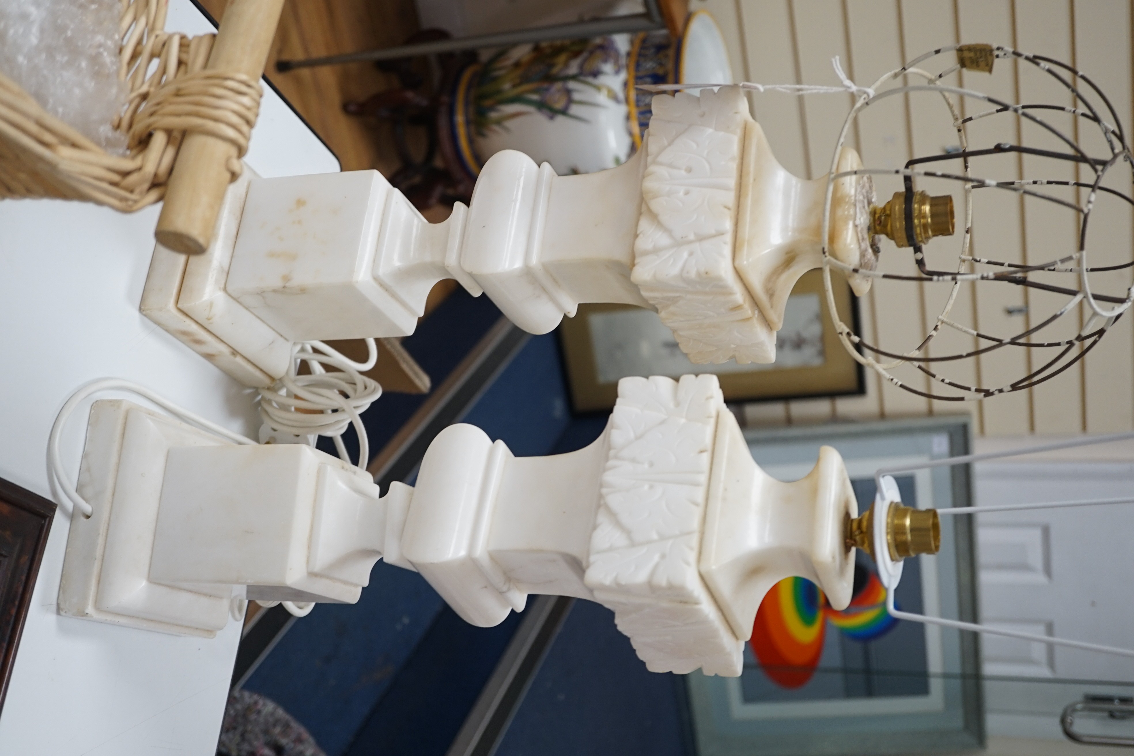 A pair of white marble table lamps, 50 cms high including light fitting